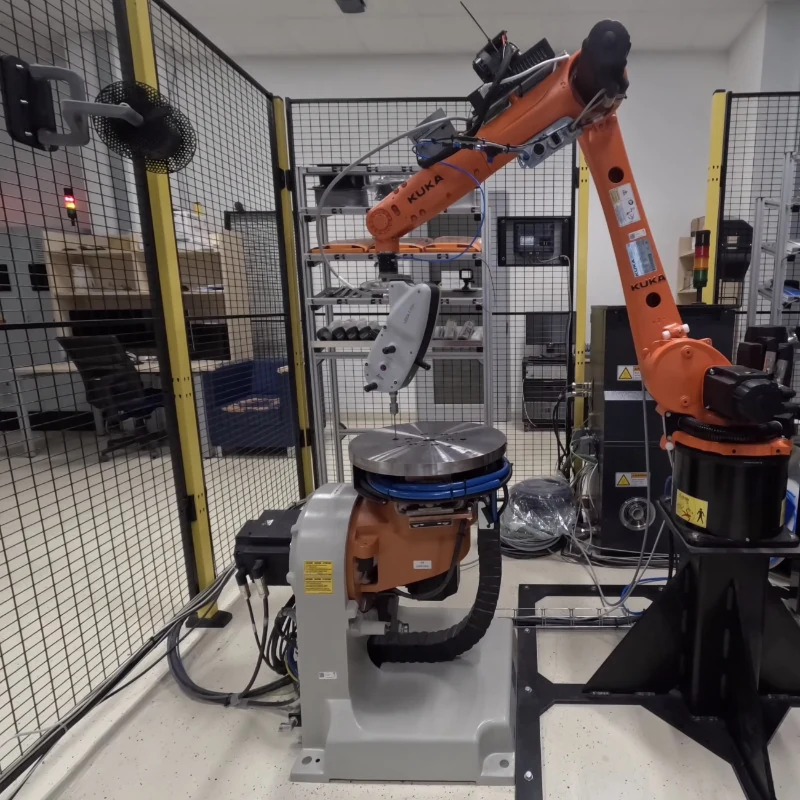 Calibrated robot and two-axis positioner used in the multi-axis additive-manufacturing workflow