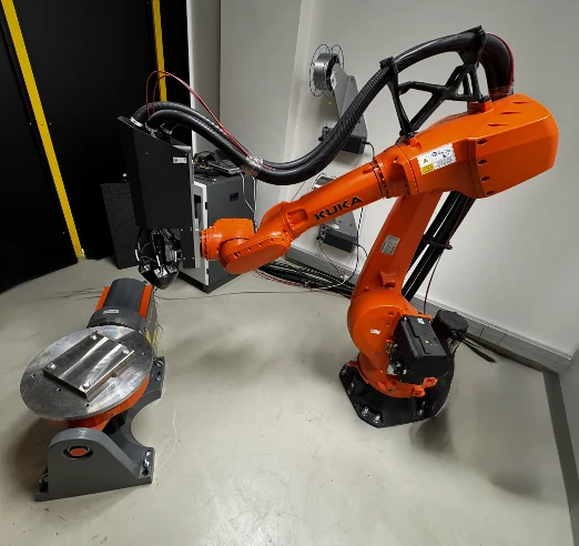 Physical KUKA and Meltio robotic wire-laser additive manufacturing cell